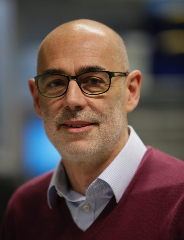 Headshot of man wearing glasses