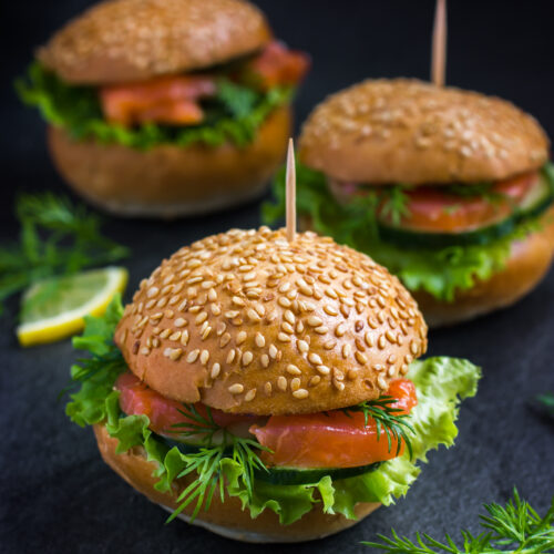 mini burgers on dark background, selective focus
