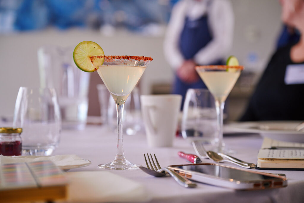 drink in a martini glass on a table