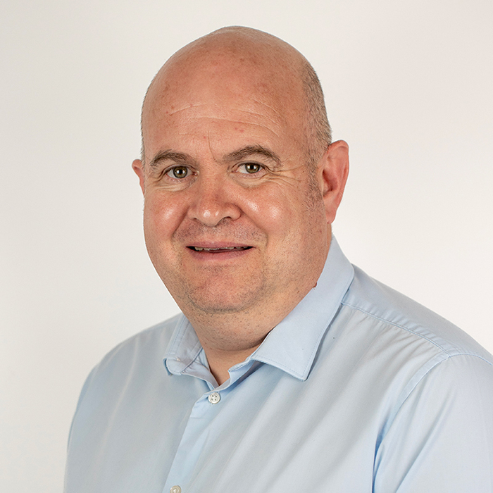 man in blue shirt smiling
